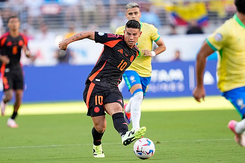 James Rodriguez kicks the ball against Brazil